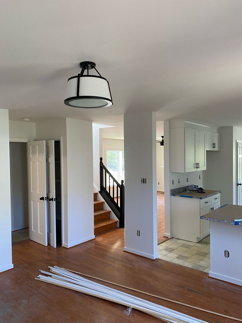 Freshly painted open interior and staircase by ProCoats Painting Plus